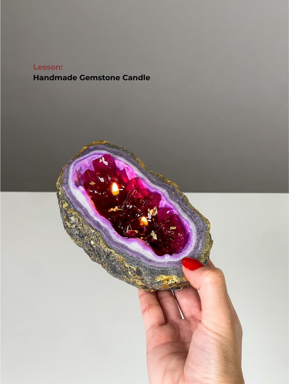 Handmade gemstone candle held in hand